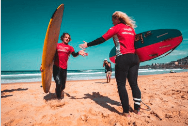 2 females surfing